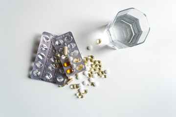 Variety of forms and blisters of vitamin D on a white table