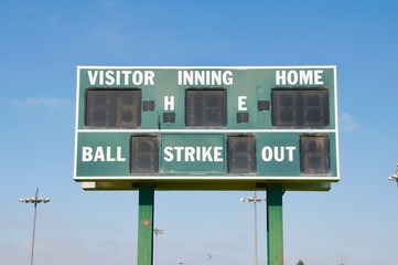 Baseball Little League score board green and white blue sky 