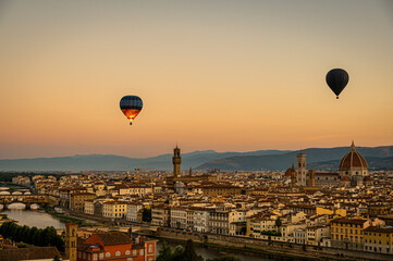 A hot balloon at sunrise over Florence