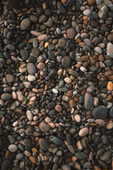 Bunch of stones laying on the seashore
