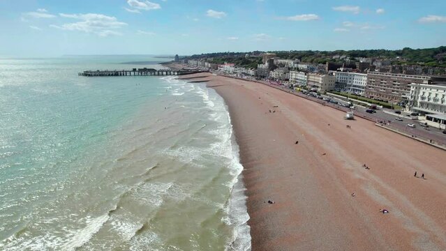 The drone aerial footage of Hastings beach and city, England. Hastings is a large seaside town and borough in East Sussex on the south coast of England.