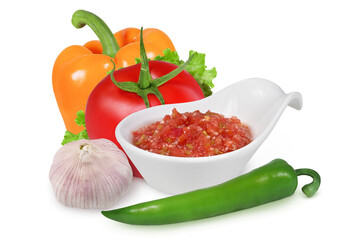 bowl of tomato sauce or Ajvar and tomato, garlic, pepper isolated on a white background. Pepper orange ang green, tomato, garlic and tomato sauce