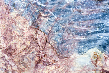 Natural stone marble rock surface by the stream.  Stone marble texture background.Selective focus.