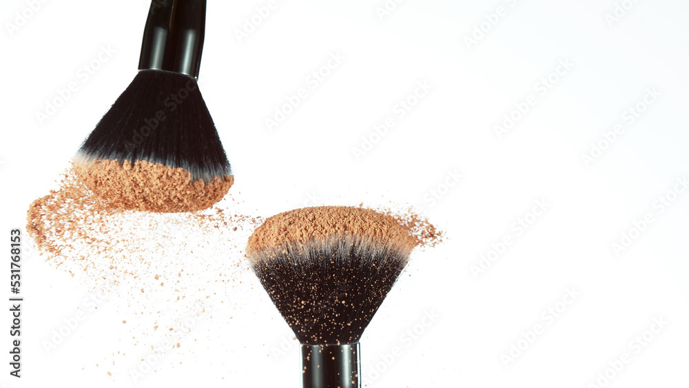 Wall mural brown makeup powder on brushes.