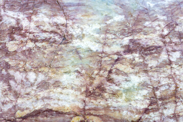 Natural stone marble rock surface by the stream.  Stone marble texture background.Selective focus.