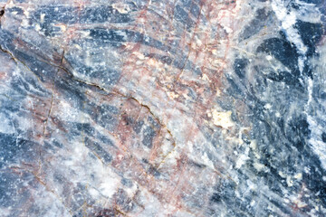 Natural stone marble rock surface by the stream.  Stone marble texture background.Selective focus.