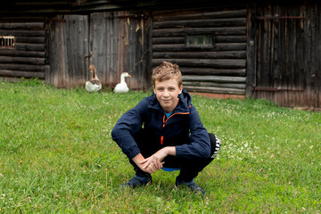 portrait of a teenager boy in the summer in the village