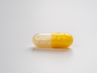 Vitamin C capsules on a white background.