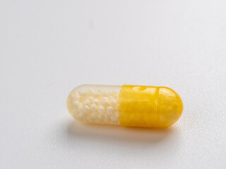 Vitamin C capsules on a white background.