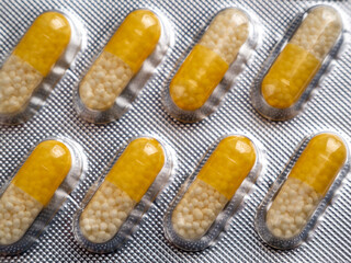 Vitamin C capsules on a white background.