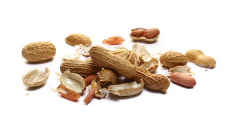 Shelled and unshelled peanuts pile isolated on white