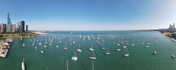 Aerial panoramic view of Chicago, Illinois, USA with numerous boats in the harbor. 