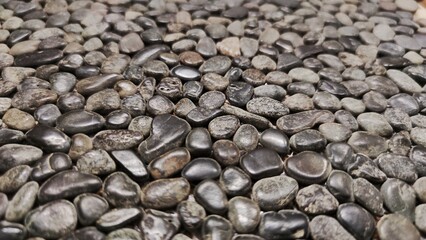 White and grey pebble stone texture wall as a background