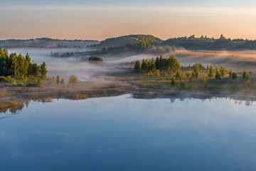 Fototapeta premium Foggy dawn in Izborsko-Malskaya Valley, Pskov region