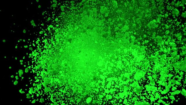 Super Slow Motion Shot of Rotating Green Powder Expolosion Isolated on Black Background at 1000fps.