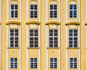 Architectural detail with the windows of an old building. Old vintage architecture in the center of Prague, Czech Republic. Seamless pattern background