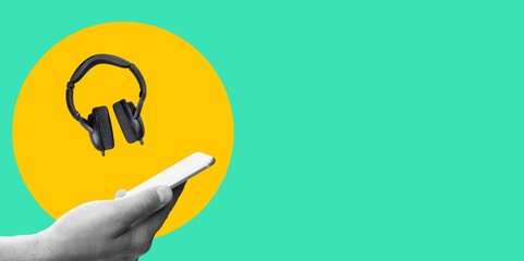 Hand with phone and modern headphone for listen music