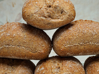 rustic wholemeal breads with a basket in the background