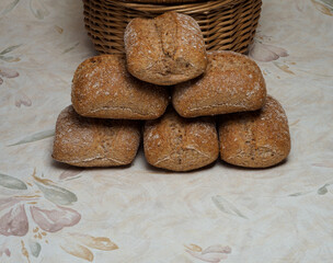 rustic wholemeal breads with a basket in the background