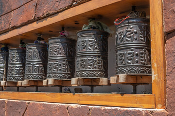 Prayer wheels with mantras on a stupa