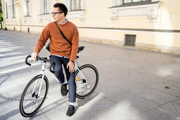 A male cyclist rides a bicycle to work in the city, ecotransport.