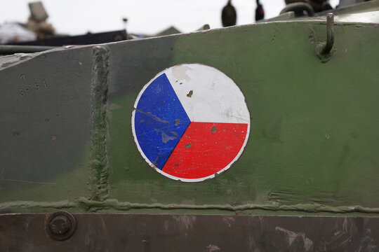 Flag of Czech Republic on green khaki background - Czech Armed Forces and Czech army. Military power and defense of state and country. Old sign is aged, tarnished and faded.