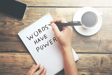 hands notepad with text Words Have Power