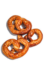 Oktoberfest concept - pretzels isolated on a white background. A trendy hard light, dark shadow