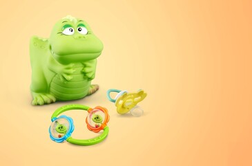 Baby accessories and toys on pastel background