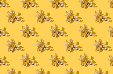 Pattern golden christmas decoration on yellow background