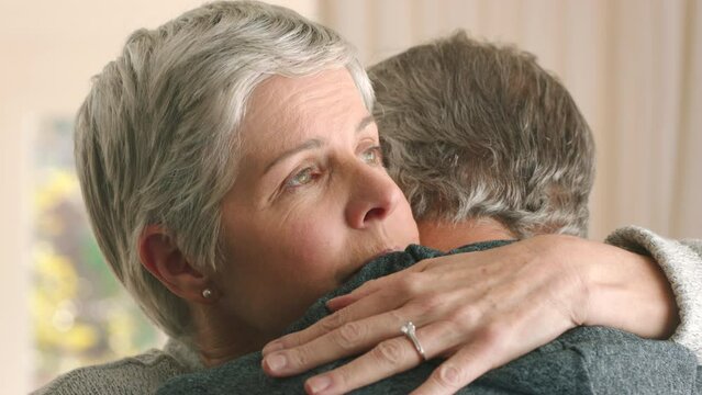 Love, support and hug with a senior couple hugging to care, console or give comfort after loss, grief and pain. Problem, lifestyle and marriage with a mature couple embrace with a sad expression