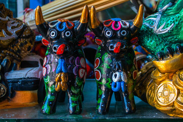 Colourful Pucara bulls in the market of San Pedro, Cusco, Peru. 