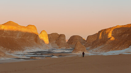 Limestone formations in the Black and White Desert at sunset. Egypt.