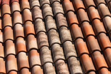 Fragment of a tiled roof close-up.