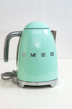 Kemerovo. Russia. May 16, 2022. close-up of the SMEG brand teapot on the kitchen table.