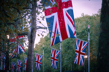 Fototapeta na wymiar Large union flags line the mall in London for royal parade 