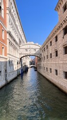 Fototapeta na wymiar Canal and bridge in Venice, Italy