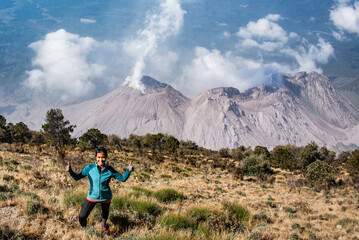 Hiker at Santiaguito lava dome erupting off Santa Maria volcano, Quetzaltenango, Guatemala