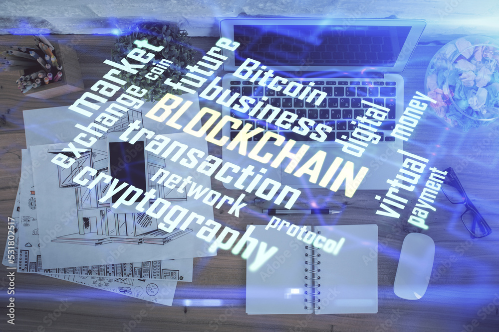 Poster Blockchain theme hologram drawings over computer on the desktop background. Top view. Double exposure.