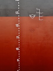 A mid draft mark, load line and plimsoll mark on a side of cargo ship or bulk carrier