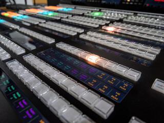 Concept Idea: Professional broadcast video mixer in tv studio as background