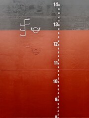 A mid draft mark, load line and plimsoll mark on a side of cargo ship or bulk carrier