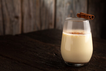 Eggnog cup with cinnamon powder.