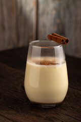 Eggnog cup with cinnamon powder.