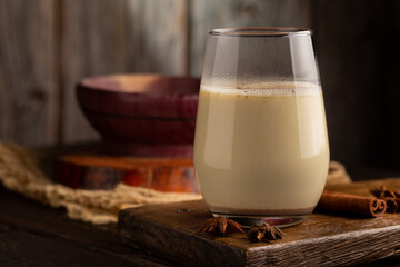 Eggnog cup with cinnamon powder.