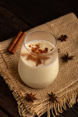 Eggnog cup with cinnamon powder.