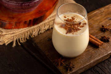 Eggnog cup with cinnamon powder.