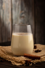 Eggnog cup with cinnamon powder.