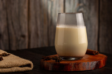 Eggnog cup with cinnamon powder.