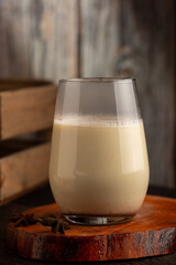 Eggnog cup with cinnamon powder.